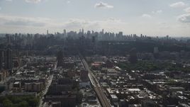 4K aerial stock footage Flying by Midtown Manhattan skyline, seen from Harlem, New York, New York Aerial Stock Footage | AX87_181