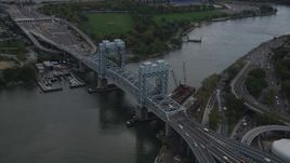4K aerial stock footage Tilting down on Robert F. Kennedy Bridge, Harlem, New York, New York Aerial Stock Footage | AX87_182