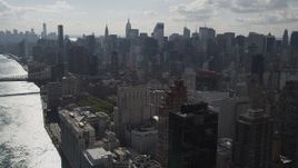 4K aerial stock footage Fly by Midtown Manhattan skyscrapers, from Upper East Side, New York Aerial Stock Footage | AX87_187