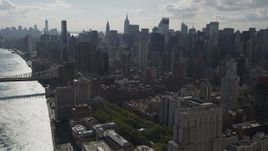 4K aerial stock footage Fly by Midtown Manhattan skyscrapers, from East River, New York, New York Aerial Stock Footage | AX87_188