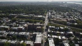 4K aerial stock footage of flying over row houses, approaching Green-Wood Cemetery, Brooklyn, New York Aerial Stock Footage | AX88_021