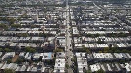 4K aerial stock footage of following 8th Avenue or urban row houses, Brooklyn, New York Aerial Stock Footage | AX88_028