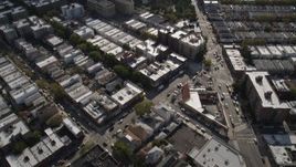 4K aerial stock footage tilt from row houses to wider view of neighborhoods and apartment buildings, Brooklyn, New York Aerial Stock Footage | AX88_037