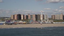 4K aerial stock footage of flying by Luna Park and Coney Island Beach in Brooklyn, New York, New York Aerial Stock Footage | AX88_055