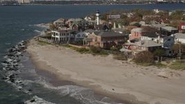 4K aerial stock footage of beachfront homes by the ocean in Coney Island, Brooklyn, New York, New York Aerial Stock Footage | AX88_070