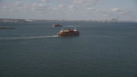 4K aerial stock footage track a Staten Island Ferry sailing New York Harbor, New York, New York Aerial Stock Footage | AX88_092