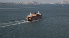 4K aerial stock footage of flying around a Staten Island Ferry sailing New York Harbor, New York, New York Aerial Stock Footage | AX88_093