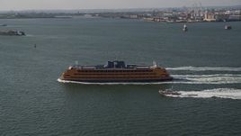 4K aerial stock footage track a Staten Island Ferry sailing New York Harbor, New York, New York Aerial Stock Footage | AX88_095
