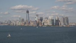 4K aerial stock footage of flying by Lower Manhattan, seen from New York Harbor, New York, New York Aerial Stock Footage | AX88_099