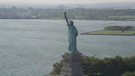 4K aerial stock footage of flying by the side of the Statue of Liberty, New York, New York Aerial Stock Footage | AX88_105
