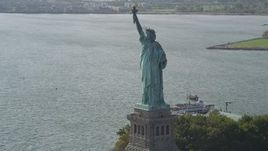 4K aerial stock footage of flying by the front of the Statue of Liberty, New York, New York Aerial Stock Footage | AX88_106