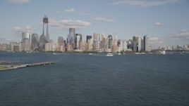 4K aerial stock footage tilt up to approach Lower Manhattan skyline, New York, New York Aerial Stock Footage | AX88_113