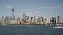 4K aerial stock footage tilt up and approach the Lower Manhattan skyline, New York, New York Aerial Stock Footage | AX88_114