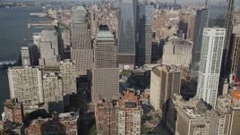 4K aerial stock footage of flying by World Trade Center Memorial and skyscrapers in Lower Manhattan, New York Aerial Stock Footage | AX88_117