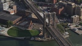 4K aerial stock footage of flying by the historic Brooklyn Bridge, New York, New York Aerial Stock Footage | AX88_122