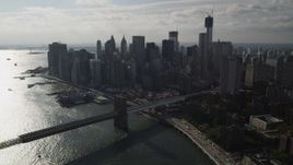 4K aerial stock footage of approaching Brooklyn Bridge and Lower Manhattan skyscrapers, New York Aerial Stock Footage | AX88_126