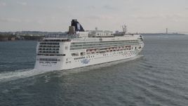 4K aerial stock footage of approaching a cruise ship sailing in the New York Harbor, New York, New York Aerial Stock Footage | AX88_178