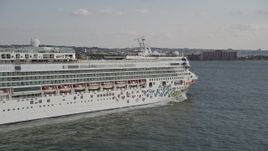 4K aerial stock footage of closely passing a cruise ship sailing New York Harbor, New York, New York Aerial Stock Footage | AX88_179