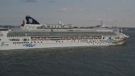 4K aerial stock footage of passing the side of a cruise ship, New York Harbor, New York, New York Aerial Stock Footage | AX88_186