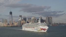 4K aerial stock footage of tracking cruise ship sailing New York Harbor, revealing Lower Manhattan skyline, New York Aerial Stock Footage | AX88_188