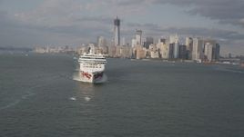 4K aerial stock footage of flying by cruise ship sailing New York Harbor, revealing Lower Manhattan skyline, New York Aerial Stock Footage | AX88_193
