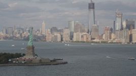 4K aerial stock footage orbit Statue of Liberty, revealing Lower Manhattan skyline, New York Aerial Stock Footage | AX88_195