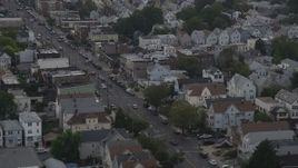 4K aerial stock footage of flying by urban neighborhoods and a broad city street, Jersey City, New Jersey Aerial Stock Footage | AX88_199