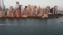 4K aerial stock footage Flying New York Harbor, revealing Lower Manhattan, New York, New York, sunset Aerial Stock Footage | AX89_003