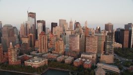 4K aerial stock footage Approaching Lower Manhattan skyscrapers, New York, New York, sunset Aerial Stock Footage | AX89_004