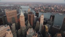 4K aerial stock footage Flying over Lower Manhattan, approaching Wall Street, New York, New York, sunset Aerial Stock Footage | AX89_006
