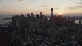 4K aerial stock footage Approaching Lower Manhattan skyscrapers, New York, New York, sunset Aerial Stock Footage | AX89_015