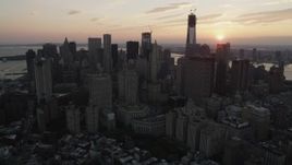 4K aerial stock footage Flying by Lower Manhattan skyscrapers, New York, New York, sunset Aerial Stock Footage | AX89_016