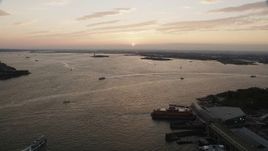 4K aerial stock footage Approaching boats, New York Harbor, New York, New York, sunset Aerial Stock Footage | AX89_019