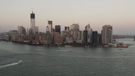 4K aerial stock footage Flying by Lower Manhattan, New York Harbor, New York, New York, sunset Aerial Stock Footage | AX89_020