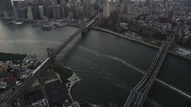 4K aerial stock footage of the Brooklyn Bridge, Manhattan Bridge, Lower Manhattan, New York, twilight Aerial Stock Footage | AX89_034