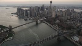 4K aerial stock footage of the Brooklyn Bridge, Manhattan Bridge, Lower Manhattan, New York, twilight Aerial Stock Footage | AX89_035