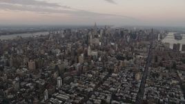 4K aerial stock footage Flying by Midtown Manhattan, seen from East Village, New York, New York, twilight  Aerial Stock Footage | AX89_038