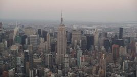 4K aerial stock footage Flying by Empire State Building, Midtown Manhattan, New York, New York, twilight Aerial Stock Footage | AX89_042