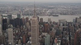 4K aerial stock footage Approaching Empire State Building, Midtown Manhattan, New York, twilight Aerial Stock Footage | AX89_044