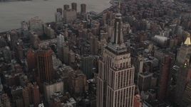4K aerial stock footage Flying by Empire State Building, Midtown Manhattan, New York, twilight Aerial Stock Footage | AX89_046