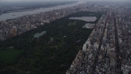 4K aerial stock footage Approaching Central Park, from Upper East Side, New York, twilight Aerial Stock Footage | AX89_066