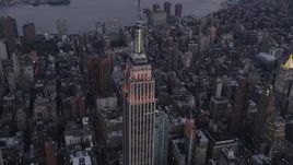 4K aerial stock footage Flying by the Empire State Building, Midtown Manhattan, New York, twilight Aerial Stock Footage | AX89_076