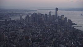 4K aerial stock footage Flying by Lower Manhattan, seen from Midtown, New York, New York, twilight Aerial Stock Footage | AX89_077