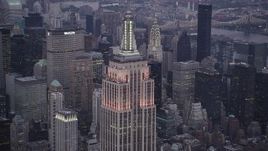4K aerial stock footage Flying by Empire State Building, Midtown Manhattan, New York, twilight Aerial Stock Footage | AX89_082