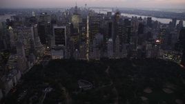 4K aerial stock footage Approaching Central Park, revealing Midtown Manhattan, New York, twilight Aerial Stock Footage | AX89_091
