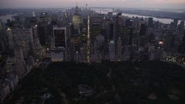 4K aerial stock footage Flying over Central Park, approaching Midtown Manhattan, New York, twilight Aerial Stock Footage | AX89_092