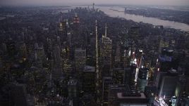 4K aerial stock footage Flying over Midtown Manhattan, approach Empire State Building, New York, twilight Aerial Stock Footage | AX89_095