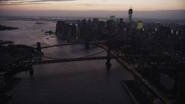 4K aerial stock footage of the Brooklyn Bridge, Manhattan Bridge, East River, Lower Manhattan, New York, twilight Aerial Stock Footage | AX89_106