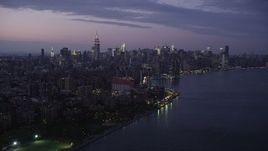 4K aerial stock footage Approaching Midtown Manhattan, seen from East River, New York, twilight Aerial Stock Footage | AX89_112