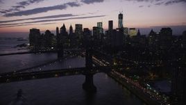 4K aerial stock footage Flying over Manhattan Bridge, approach Lower Manhattan, New York, twilight Aerial Stock Footage | AX89_122